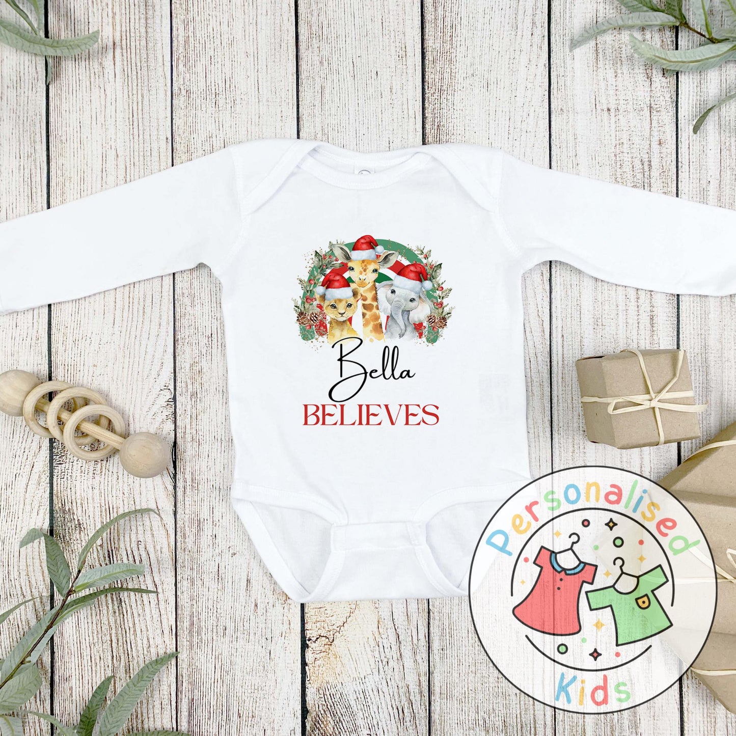 Make this Christmas even more magical with our Personalised Christmas onesie pj – perfect for the whole family! These white cotton bay onsies feature an adorable festive safari animal design, complete with your chosen name and the word "BELIEVES" printed underneath in bold red. Whether you're matching on Christmas morning, heading to a festive event, or capturing the perfect holiday photo, these cosy onsies are the perfect touch of personalised Christmas cheer.
