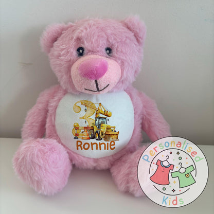 This adorable personalised teddy bear makes the perfect gift for little construction fans! The soft plush bear features a printed design with a yellow digger, crane, and traffic cones, along with your child’s name and age. A thoughtful keepsake that can be paired with our matching clothing range for a complete birthday gift set.