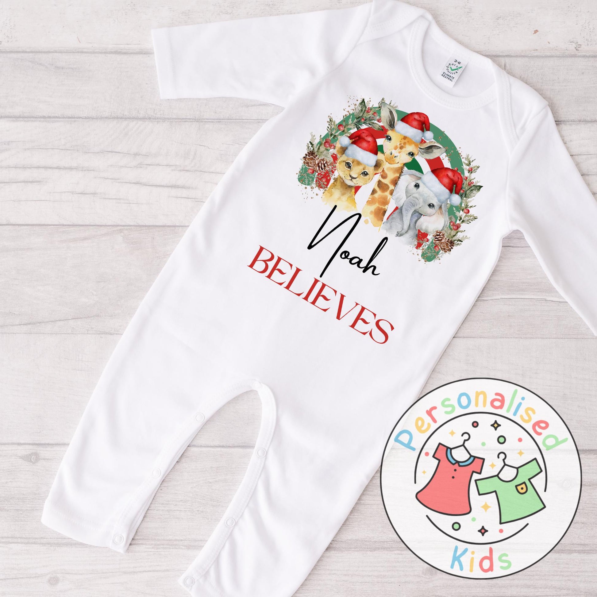 Make this Christmas even more magical with our Personalised Christmas onesie pj – perfect for the whole family! These white cotton bay onsies feature an adorable festive safari animal design, complete with your chosen name and the word &quot;BELIEVES&quot; printed underneath in bold red. Whether you&#39;re matching on Christmas morning, heading to a festive event, or capturing the perfect holiday photo, these cosy onsies are the perfect touch of personalised Christmas cheer.
