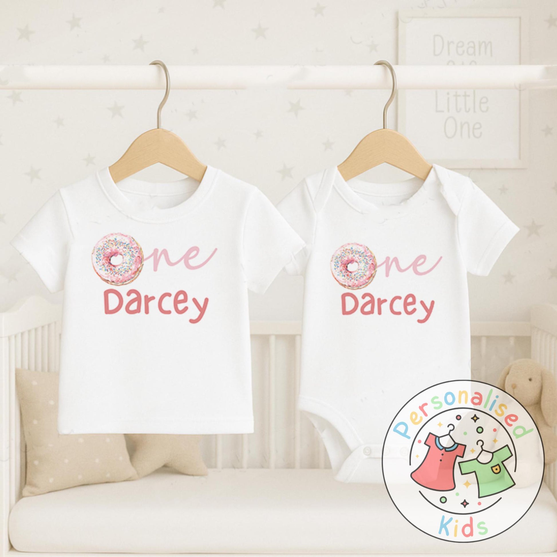 Make their first birthday extra sweet with this adorable personalised donut birthday outfit. Featuring the word “One” with a colourful sprinkle donut design in place of the “O”, and your child’s name personalised underneath, this outfit is perfect for birthday celebrations, cake smash photos, or as a keepsake to treasure.