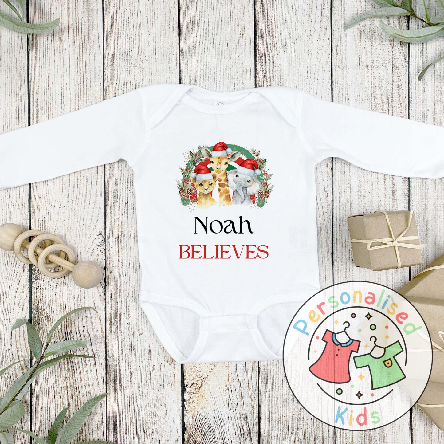Make this Christmas even more magical with our Personalised Christmas onesie pj – perfect for the whole family! These white cotton bay onsies feature an adorable festive safari animal design, complete with your chosen name and the word &quot;BELIEVES&quot; printed underneath in bold red. Whether you&#39;re matching on Christmas morning, heading to a festive event, or capturing the perfect holiday photo, these cosy onsies are the perfect touch of personalised Christmas cheer.