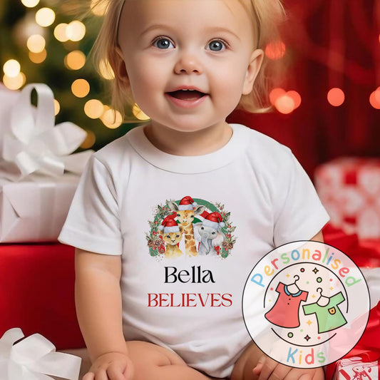 Make this Christmas even more magical with our Personalised Christmas onesie pj – perfect for the whole family! These white cotton bay onsies feature an adorable festive safari animal design, complete with your chosen name and the word &quot;BELIEVES&quot; printed underneath in bold red. Whether you&#39;re matching on Christmas morning, heading to a festive event, or capturing the perfect holiday photo, these cosy onsies are the perfect touch of personalised Christmas cheer.